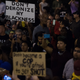 Protesters hold signs in front of the Charlotte Mecklenburg Police Department during a demonstration in Charlotte, N.C., on Sept. 23, 2016, following the shooting of Keith Lamont Scott by police three days earlier and subsequent unrest in the city.
NICHOLAS KAMM/AFP/Getty Images